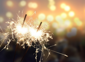 two sparkles lit at a new year's eve celebration